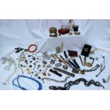 Assorted costume jewellery including a cameo bracelet, wristwatches, lighters,
