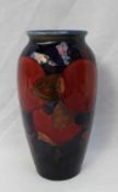 A Moorcroft pomegranate pattern vase, with a Royal blue ground, impressed marks and initials, 18.