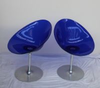 A pair Eros Kartell blue plastic swivel chairs, designed by Philippe Starck for Kartell,