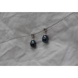 A pair of black pearl and diamond drop earrings,