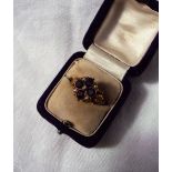 An Amethyst and Pearl ring, set with four round faceted amethysts and five seed pearls,