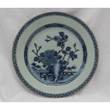 A Chinese porcelain charger, decorated to the centre with a fence pattern, trees and flowers, 31.