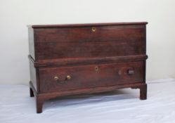 An 18th century oak coffer, the planked rectangular top above a single drawer on bracket feet,