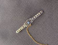 A sapphire and seed pearl bar brooch,