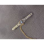 A sapphire and seed pearl bar brooch,