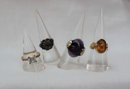 A 9ct gold citrine set dress ring together with a silver amethyst set ring and two other rings