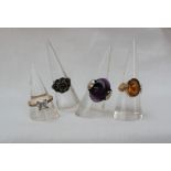 A 9ct gold citrine set dress ring together with a silver amethyst set ring and two other rings