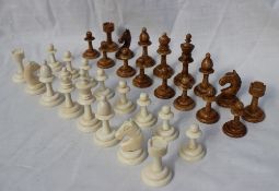 A 19th century ivory chess set, with turned columns, natural and stained brown, King 6.