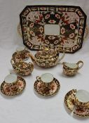 A Royal Crown Derby tea set, 2451 pattern decorated in the Imari palette, including a tray, teapot,
