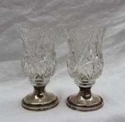 A pair of Edward VII silver and cut glass vases, of flared form, on a spreading foot, Birmingham,