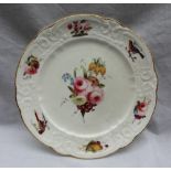 A Nantgarw porcelain plate painted to the centre with a spray of garden flowers,