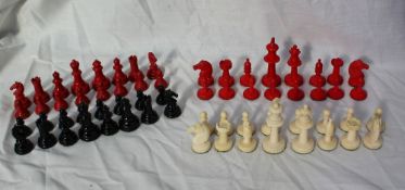 A Staunton pattern bone chess set, natural and stained red, the king 7cm high,