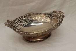 A George VI silver pedestal dish of oval form with a pierced rim, engraved to the centre, Sheffield,