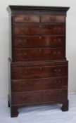 A George III mahogany chest on chest, the moulded dentil cornice above a blind fretwork frieze,
