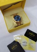 A Gentleman's Invicta wristwatch, with a blue dial on a gilt metal stainless steel bracelet strap,