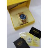 A Gentleman's Invicta wristwatch, with a blue dial on a gilt metal stainless steel bracelet strap,