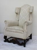 A 19th century wing back chair,