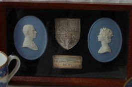 A pair of Wedgwood jasper plaques of oval form depicting Queen Elizabeth II and Prince Phillip