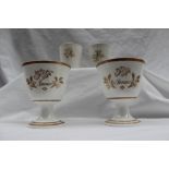 A pair of 19th century porcelain beakers, one initialled 'M', the other 'R',