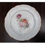 A Nantgarw porcelain plate, with a C scroll border and dentil gilt rim,