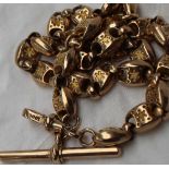 A yellow metal Albert chain with oval star engraved links, marked 10ct, approximately 34 grams, 40.