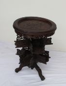 A continental oak occasional table with a dished circular top,