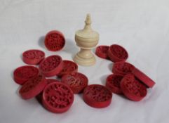 A set of sixteen 19th century Cantonese carved ivory circular draughts pieces,