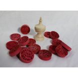 A set of sixteen 19th century Cantonese carved ivory circular draughts pieces,