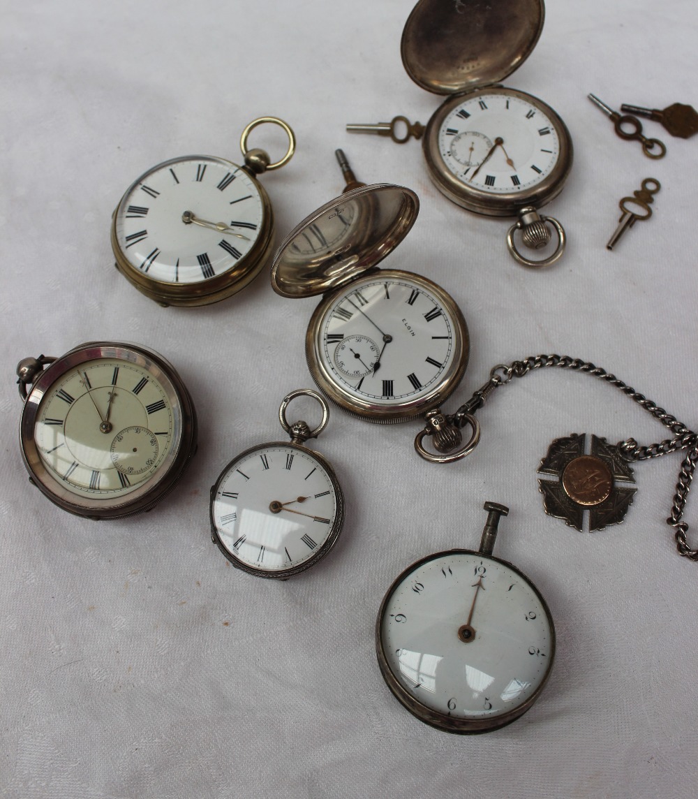 Four silver open-faced pocket watches,