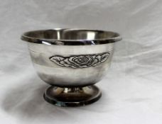 An Elizabeth II silver rose bowl, with a fold over top, on a spreading foot,
