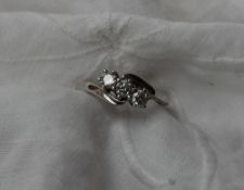 A three stone diamond ring, approximately 0.