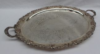 An electroplated on copper twin handled tray, cast with leaves and grapes,