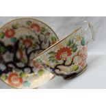 A 19th century porcelain tea cup and saucer,