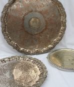 A large electroplated on copper tray of circular form, engraved to the centre with a coat of arms,