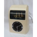 A Vitascope Industries Ltd bakelite Art Deco style electric ship automata clock the cream painted