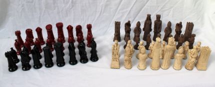 A pottery chess set, red and black glaze, King 10.7cm high, Pawn 7.