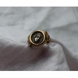 A 14ct yellow gold ring set with a Roman coin,