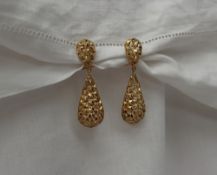 A pair of 9ct yellow gold drop earrings, of double pointed oval form,