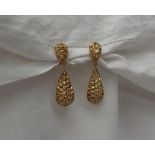 A pair of 9ct yellow gold drop earrings, of double pointed oval form,