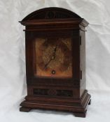 An early 20th century mahogany mantle clock, with a domed top,