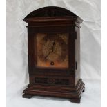 An early 20th century mahogany mantle clock, with a domed top,