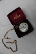 A 9ct gold open faced keyless wound pocket watch with an enamel dial and seconds subsidiary dial