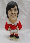 A resin Grogg of Barry John, in a red Wales jersey with a No.