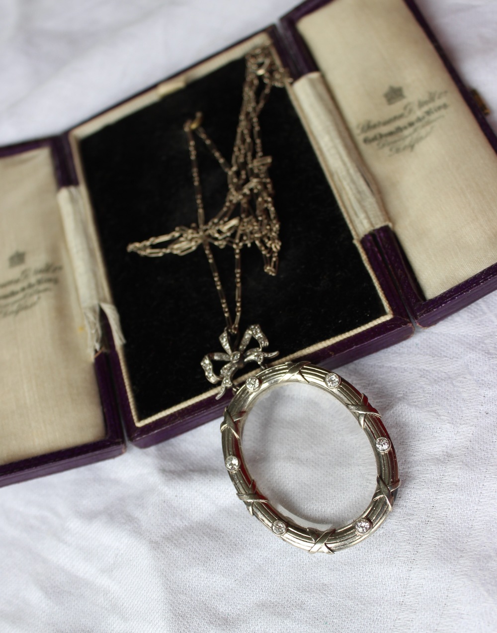 A diamond set mourning pendant locket,