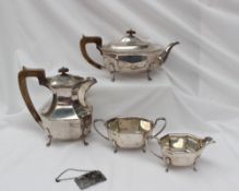 A George VI silver four piece tea set, comprising a hot water pot, teapot,