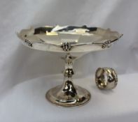 A George V silver pedestal dish, with a panelled body on a spreading foot, Birmingham, 1911, Martin,
