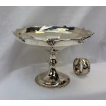 A George V silver pedestal dish, with a panelled body on a spreading foot, Birmingham, 1911, Martin,