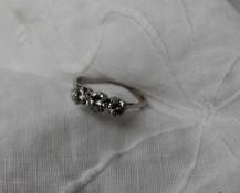 A Three stone diamond ring,