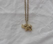 An 18ct yellow gold rope twist necklace, together with an 18ct yellow gold elephant pendant,