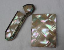 A mother of pearl and white metal inlaid card case,
